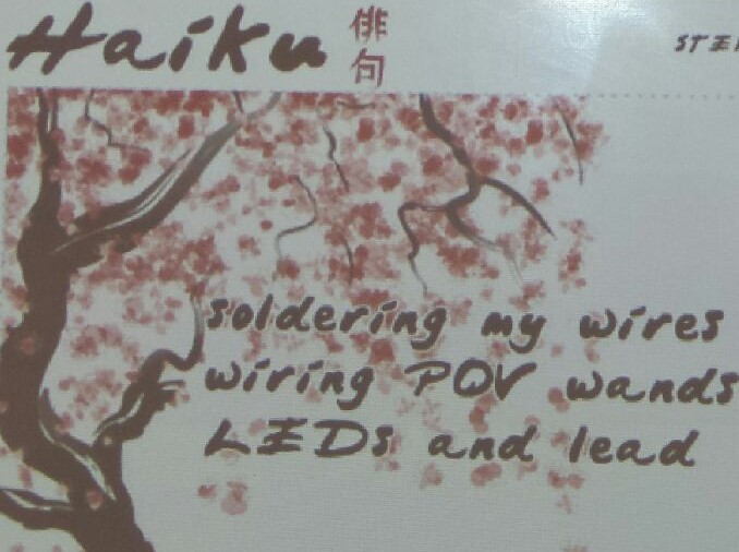 Haiku about circuits with cherry blossom art in background